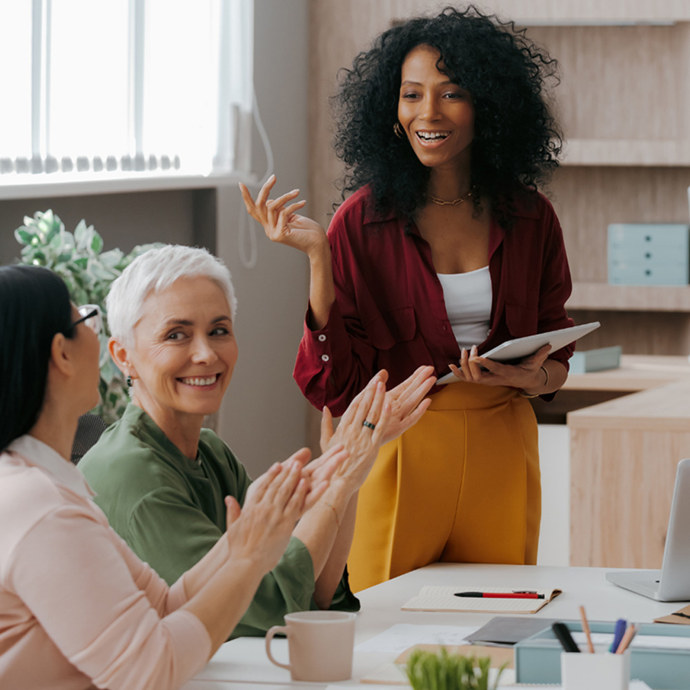Woman speaking to other women.